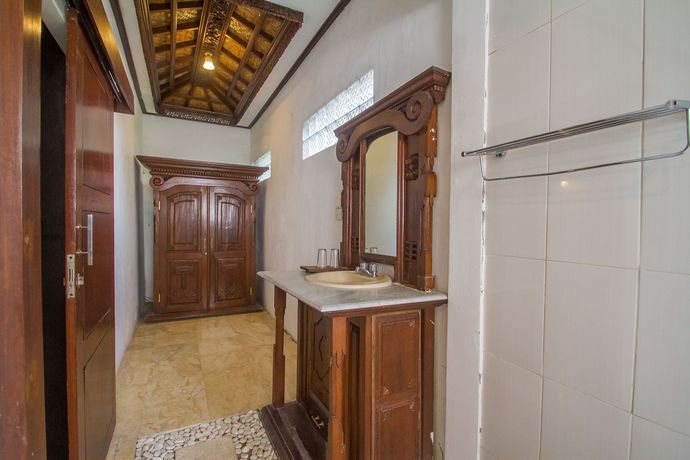 Imagen de la habitación del Hotel Collection O Ubud Near Central Ubud. Foto 11