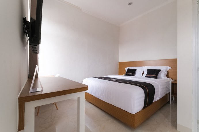 Imagen de la habitación del Hotel Collection O near Ambarrukmo Plaza Mall. Foto 17