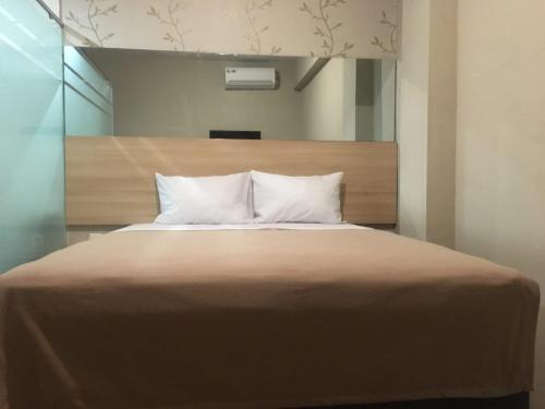 Imagen de la habitación del Hotel Collection O near Lampung City Mall. Foto 18