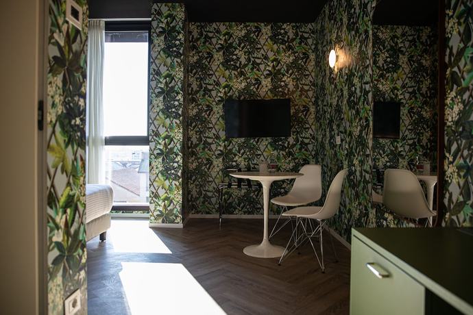 Imagen de la habitación del Hotel Collini Rooms. Foto 9