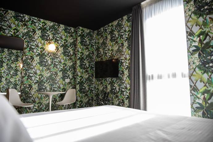 Imagen de la habitación del Hotel Collini Rooms. Foto 15