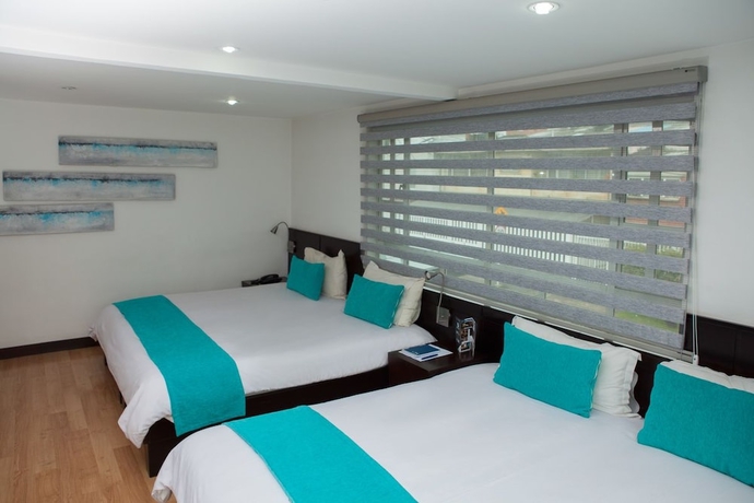 Imagen de la habitación del Hotel Colombians Suite International. Foto 7