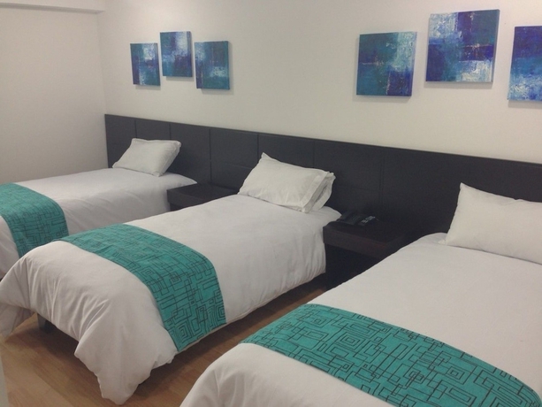 Imagen de la habitación del Hotel Colombians Suite International. Foto 8