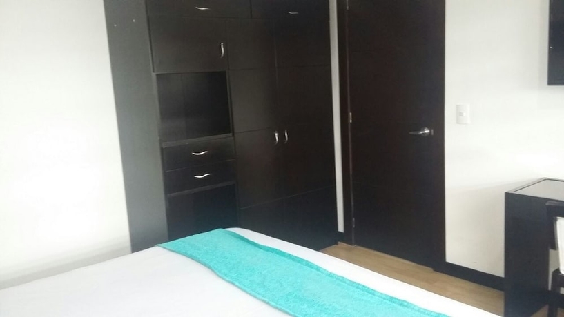 Imagen de la habitación del Hotel Colombians Suite International. Foto 10