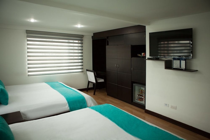Imagen de la habitación del Hotel Colombians Suite International. Foto 13