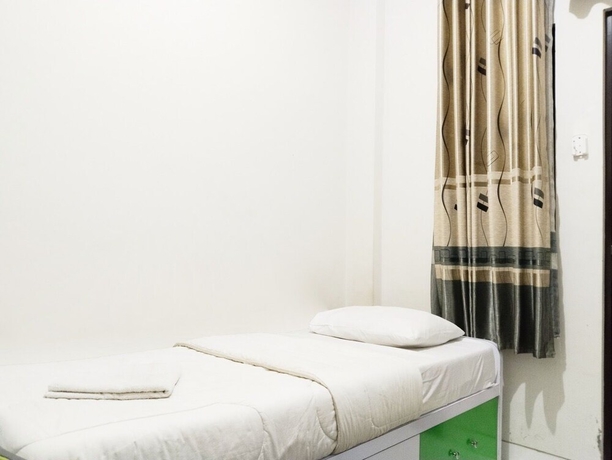 Imagen de la habitación del Hotel Colombus Homy Syariah. Foto 2