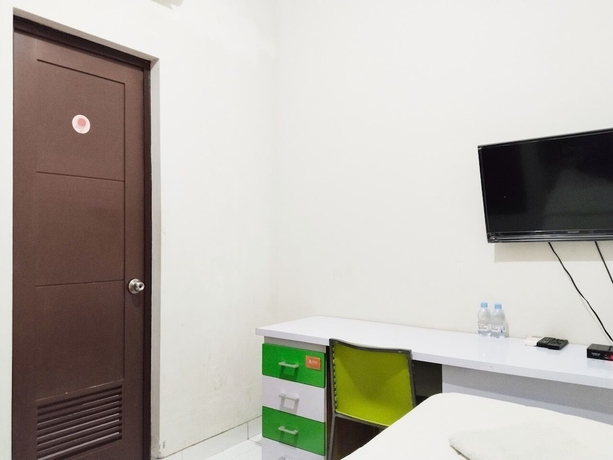 Imagen de la habitación del Hotel Colombus Homy Syariah. Foto 9