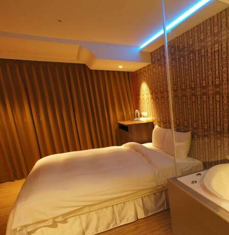 Imagen de la habitación del Hotel Colors Infinity Inn. Foto 15