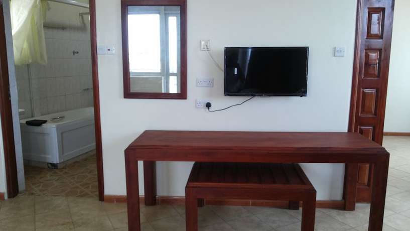 Imagen de la habitación del Hotel Com Apartment. Foto 10