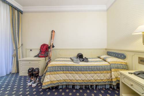 Imagen de la habitación del Hotel Comano Cattoni Holiday. Foto 6