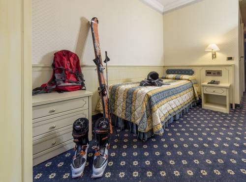 Imagen de la habitación del Hotel Comano Cattoni Holiday. Foto 13