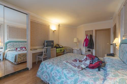 Imagen de la habitación del Hotel Comano Cattoni Holiday. Foto 14