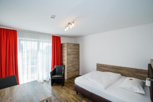 Imagen de la habitación del Hotel Come IN. Foto 5