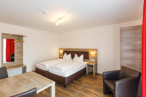 Imagen de la habitación del Hotel Come IN. Foto 6