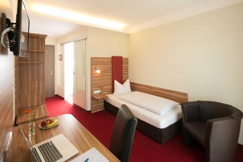 Imagen de la habitación del Hotel Come IN. Foto 7