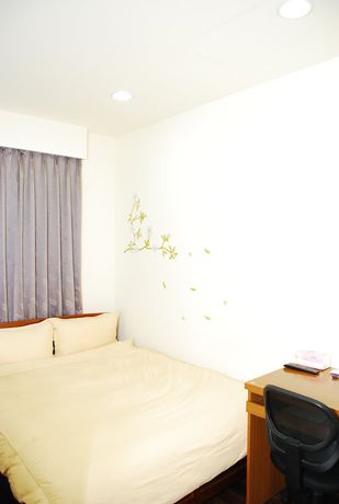 Imagen de la habitación del Hotel Come Inn Taipei. Foto 2