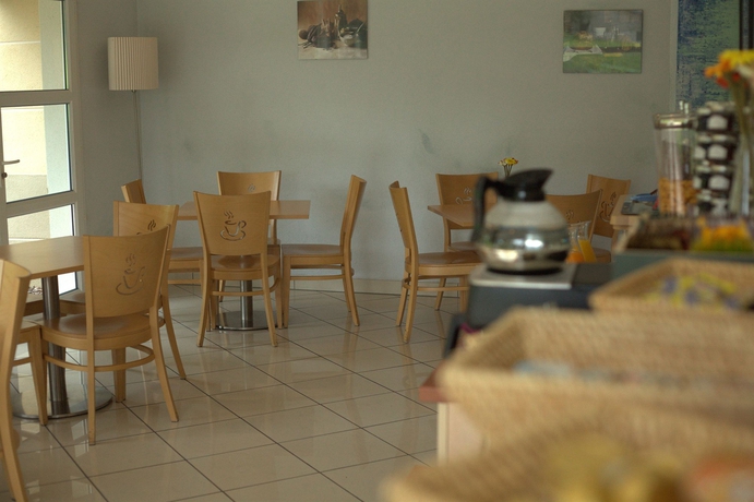 Imagen del bar/restaurante del Hotel Comfort Aparthotel Divonne L'Oree du Parc. Foto 3