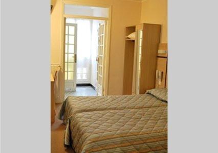 Imagen de la habitación del Hotel Comfort Au Firmament Asnieres-sur-seine. Foto 8