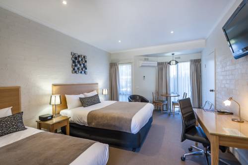 Imagen de la habitación del Hotel Comfort Inn Coach and Bushmans. Foto 1