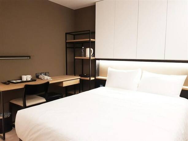 Imagen de la habitación del Hotel Comin' Place. Foto 19