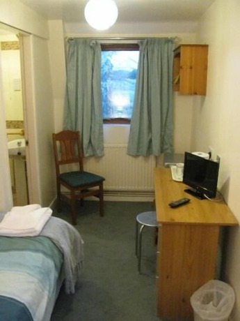 Imagen de la habitación del Hotel Common Farm Motel. Foto 13