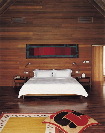 Imagen de la habitación del Hotel Como Cocoa Island. Foto 8