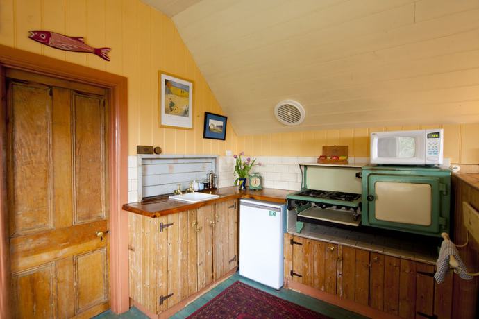 Imagen de la habitación del Hotel Como Cottages Accommodation. Foto 15