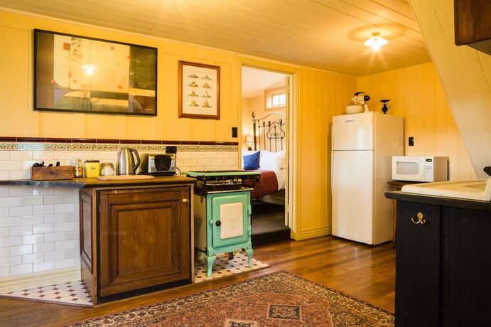 Imagen de la habitación del Hotel Como Cottages Accommodation. Foto 16