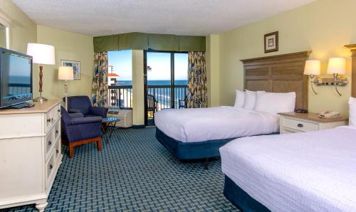 Imagen de la habitación del Hotel Compass Cove. Foto 7