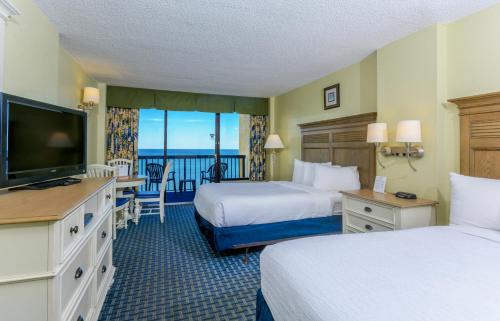 Imagen de la habitación del Hotel Compass Cove. Foto 8