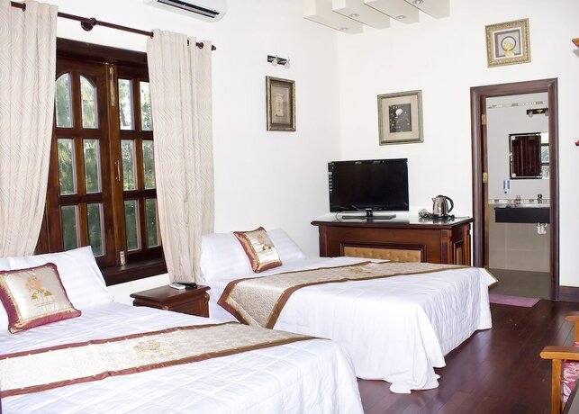 Imagen de la habitación del Hotel Con Ga Vang Resort. Foto 14