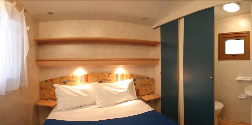 Imagen de la habitación del Hotel Concept Village Piccola Gardiola. Foto 8