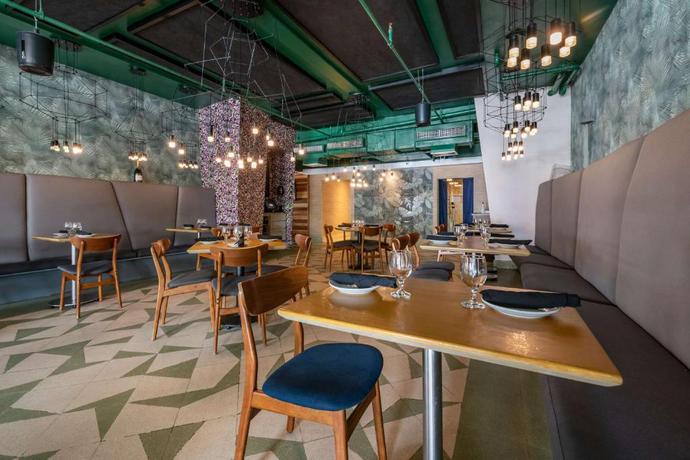 Imagen del bar/restaurante del Hotel Condado Palm Inn San Juan, Tapestry Collection by Hilton. Foto 4