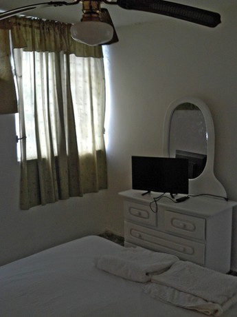 Imagen de la habitación del Hotel Condo Carla. Foto 7