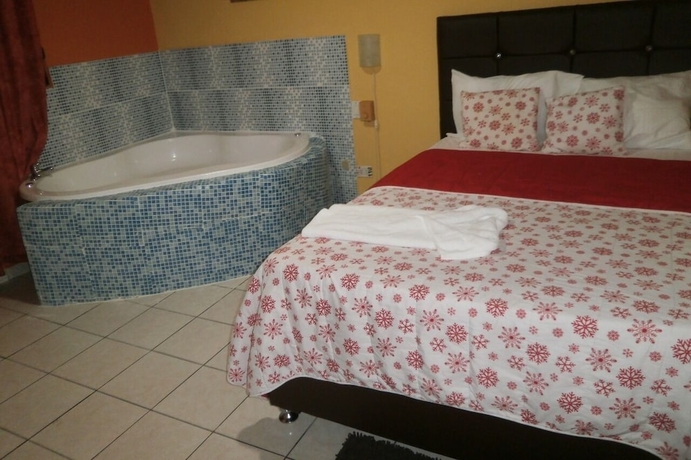Imagen de la habitación del Hotel Condo Mango. Foto 4