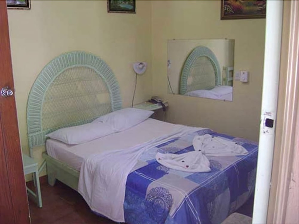 Imagen de la habitación del Hotel Condo Mango. Foto 7