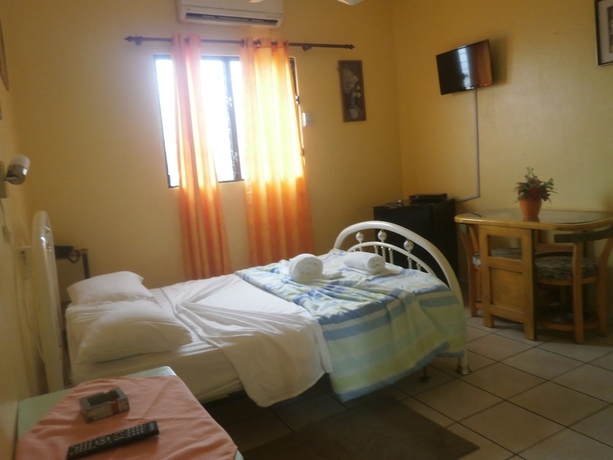 Imagen de la habitación del Hotel Condo Mango. Foto 15