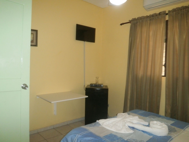 Imagen de la habitación del Hotel Condo Mango. Foto 16