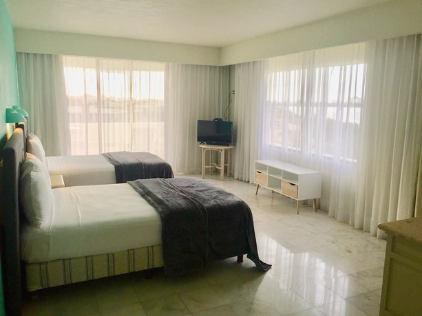 Imagen de la habitación del Hotel Condo in Ocean Front resort. Foto 14