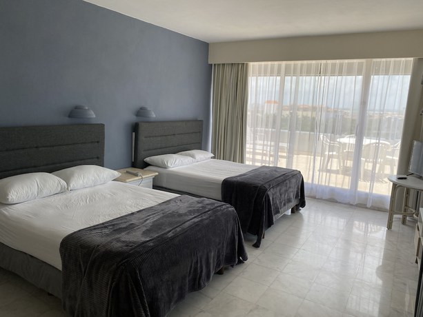 Imagen de la habitación del Hotel Condo in Ocean Front resort. Foto 19