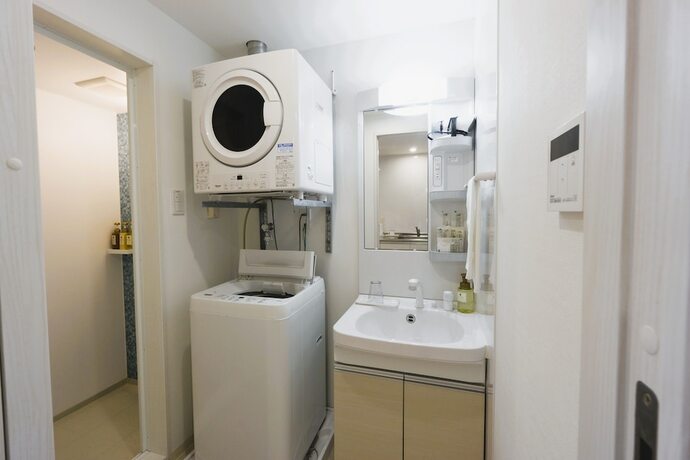 Imagen de la habitación del Hotel Condominio Miyako Airport. Foto 10