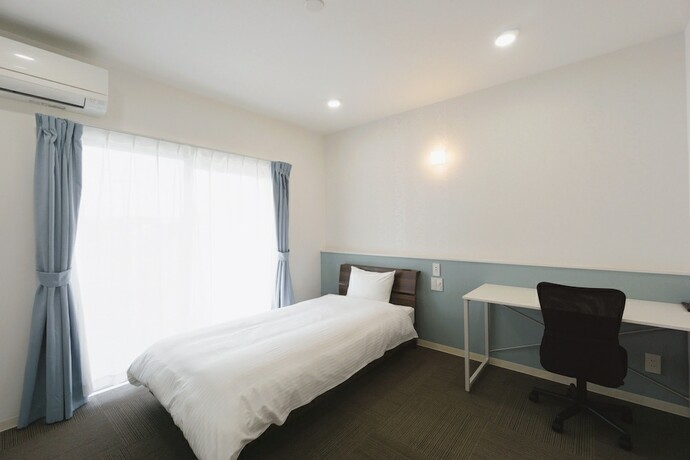 Imagen de la habitación del Hotel Condominio Miyako Airport. Foto 11