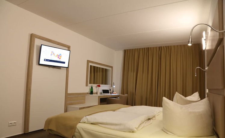 Imagen de la habitación del Hotel Confour. Foto 7