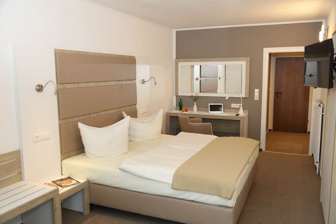 Imagen de la habitación del Hotel Confour. Foto 11