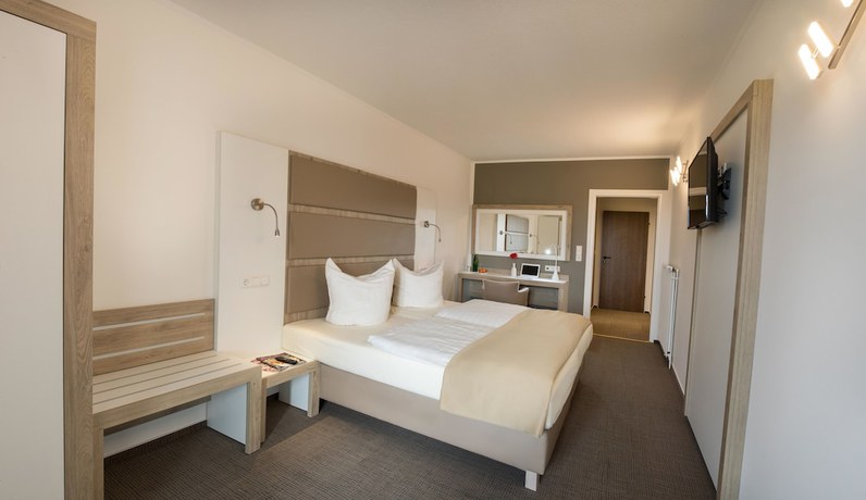 Imagen de la habitación del Hotel Confour. Foto 17