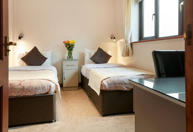 Imagen de la habitación del Hotel Conifers Guest House. Foto 16