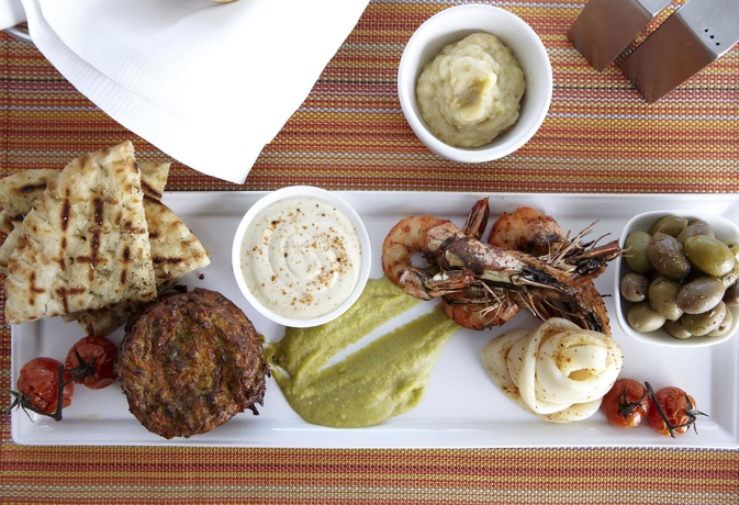 Imagen del bar/restaurante del Hotel Conrad Athens The Ilisian. Foto 3