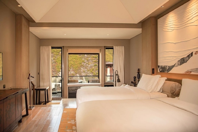 Imagen de la habitación del Hotel Conrad Jiuzhaigou. Foto 2