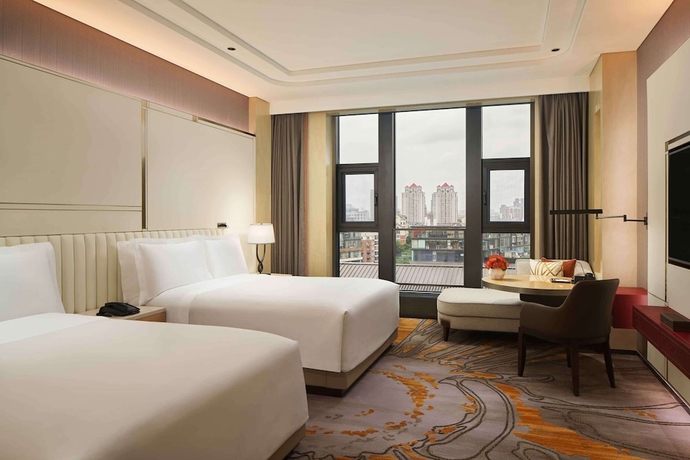 Imagen de la habitación del Hotel Conrad Tianjin. Foto 9