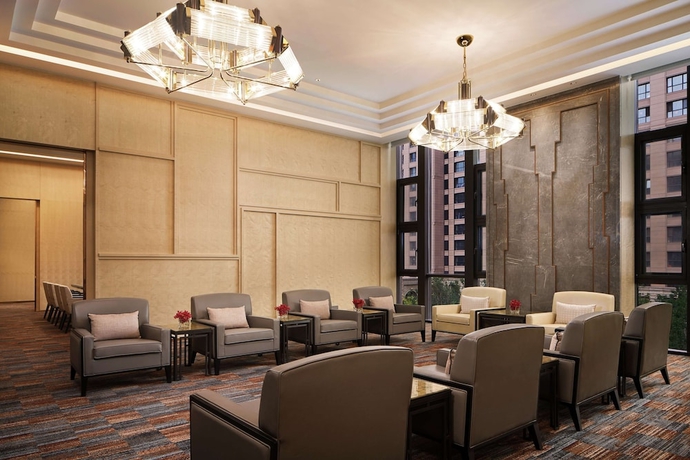 Imagen de la habitación del Hotel Conrad Tianjin. Foto 13